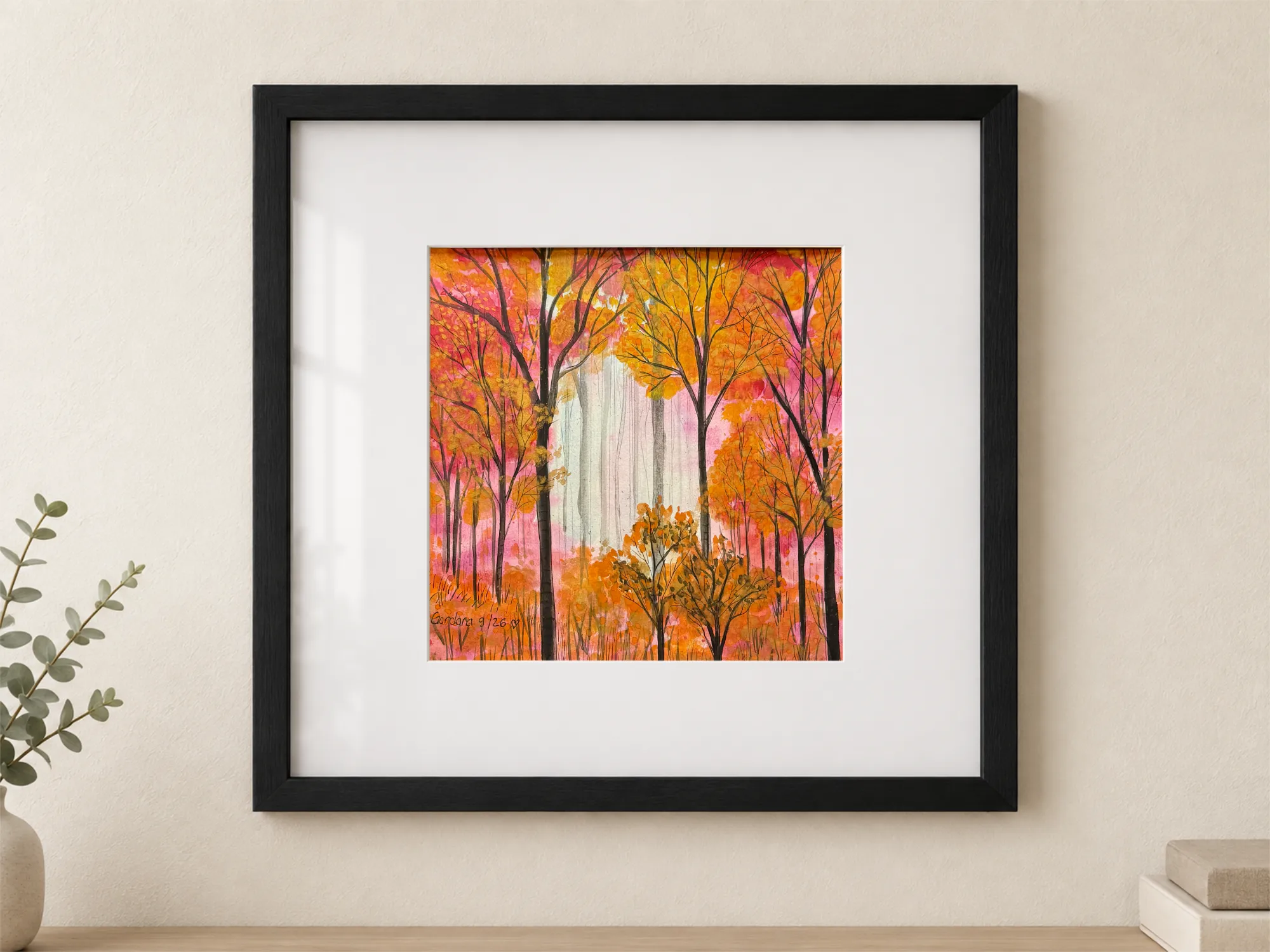 Watercolor and India ink on paper depicting a forest in tones of gold, orange, pink, and fuchsia, with dark trunks, bright foliage, and a light clearing in the background; painting 29 × 29 cm, with white mat, protective glass, and black frame, external dimensions 54 × 54 cm.